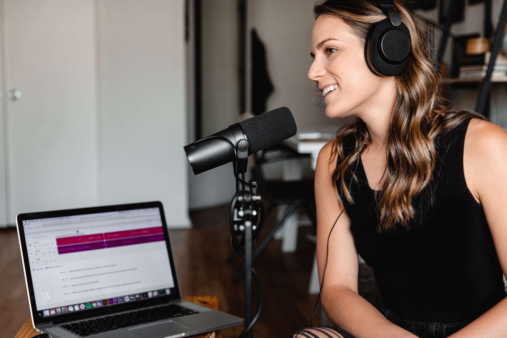 woman podcasting benefits of podcasts